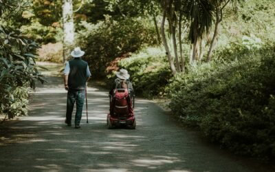 a man and a woman walking down a dirt road