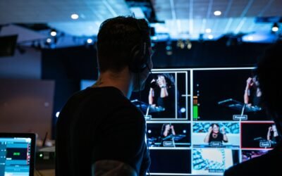man in black crew neck t-shirt standing in front of people