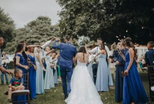 people in white dress dancing on green grass field during daytime
