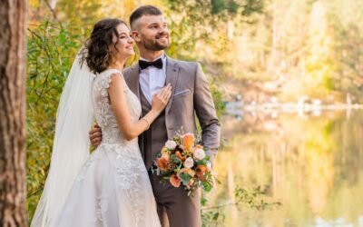 man in gray suit and woman in white wedding dress