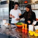 man and woman cooking