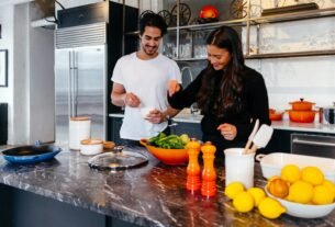 man and woman cooking